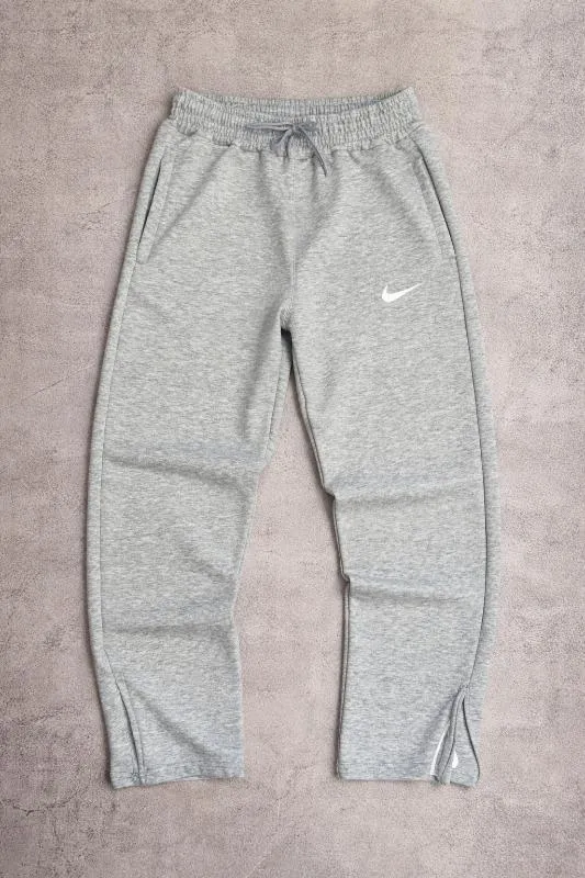 BAGGY NIKE CON CIERRE GRIS